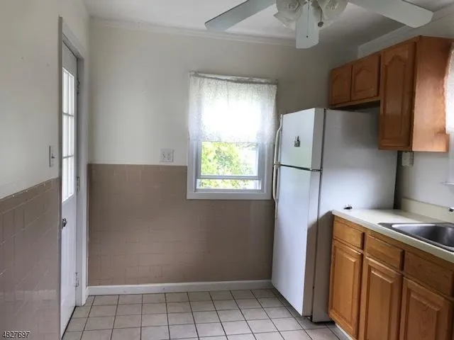 a kitchen with stainless steel appliances a refrigerator and a stove