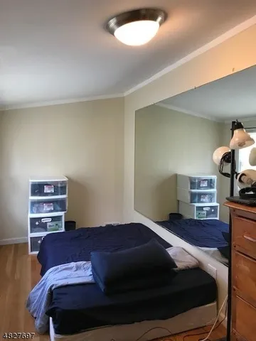 a bedroom with a bed and cabinets