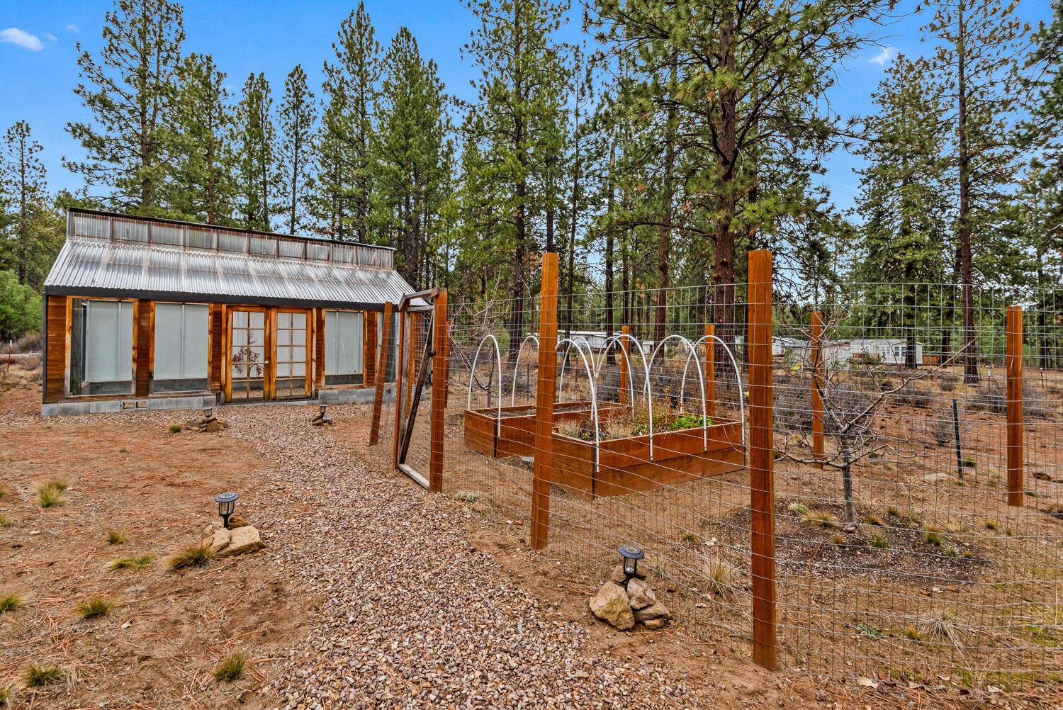 19354 Kiowa Road Bend, OR 97702 - Photo 26 of 37 a house with trees in the background