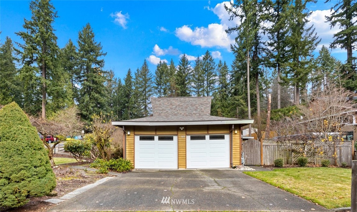 16418 Southeast 145th Street Renton, WA 98059 - Photo 1 of 25 a front view of a house with a yard and garage