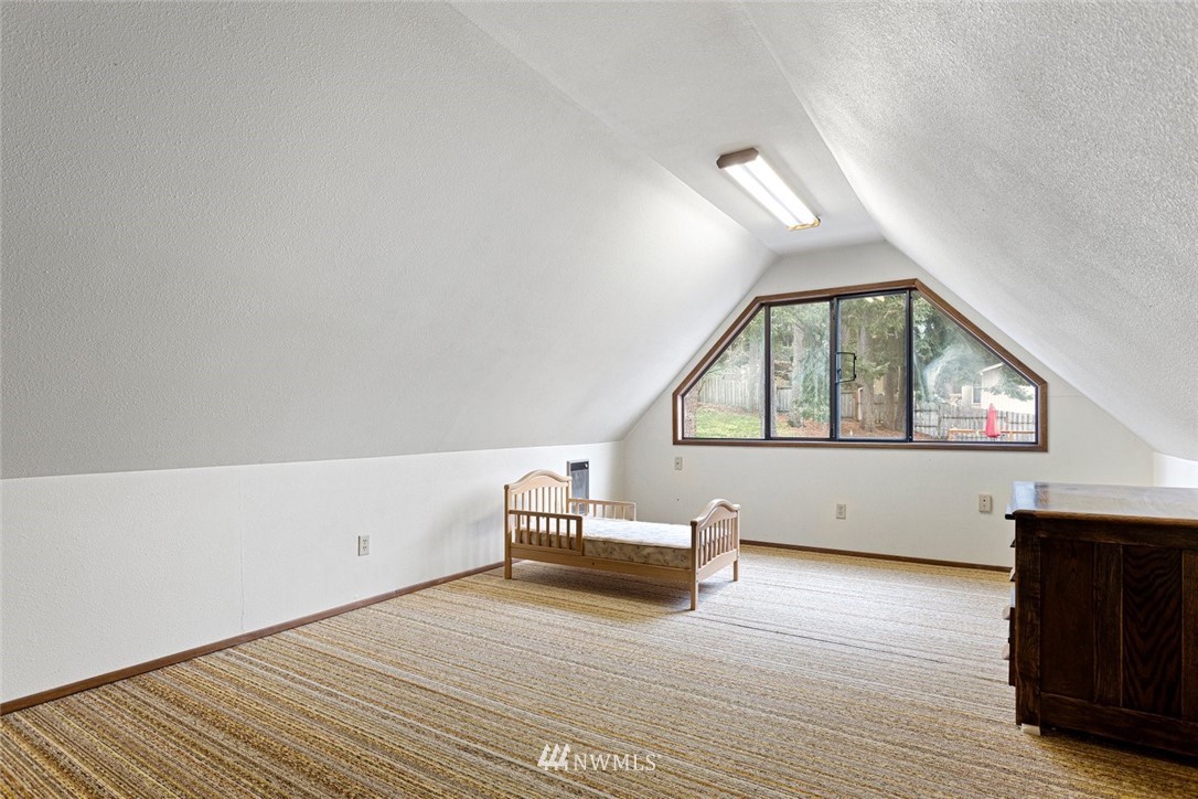 16418 Southeast 145th Street Renton, WA 98059 - Photo 16 of 25 a view of empty room with wooden floor and fan