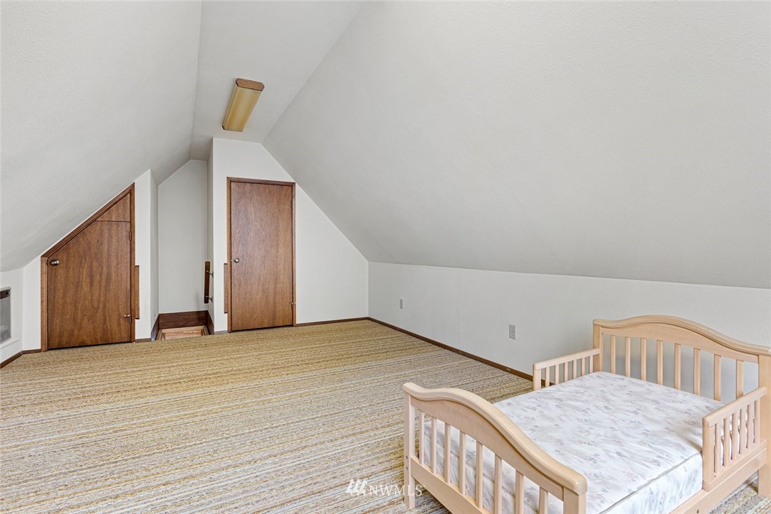 16418 Southeast 145th Street Renton, WA 98059 - Photo 17 of 25 a view of an empty room and wooden floor