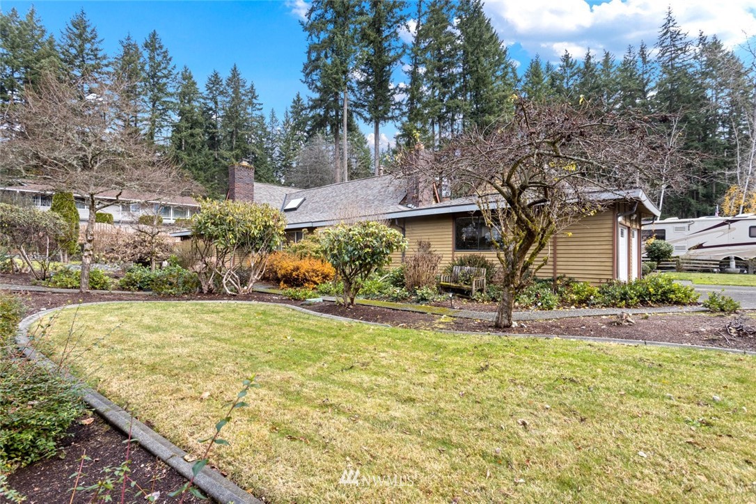 16418 Southeast 145th Street Renton, WA 98059 - Photo 2 of 25 a view of a house with yard and tree s