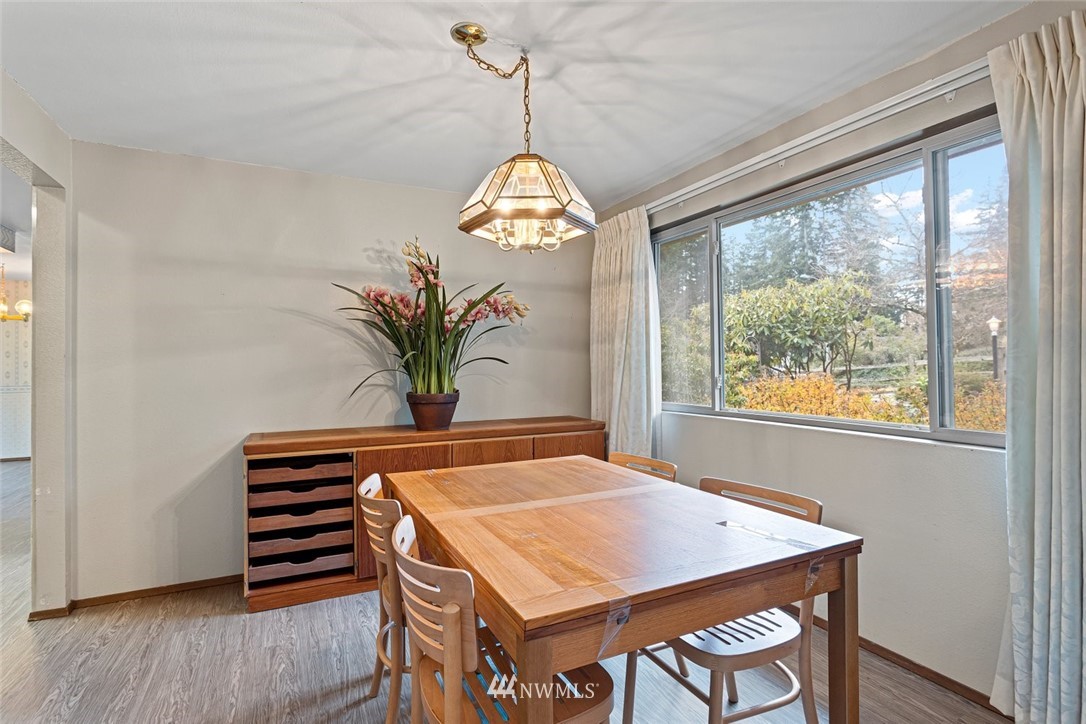 16418 Southeast 145th Street Renton, WA 98059 - Photo 5 of 25 a dining room with a table and chairs