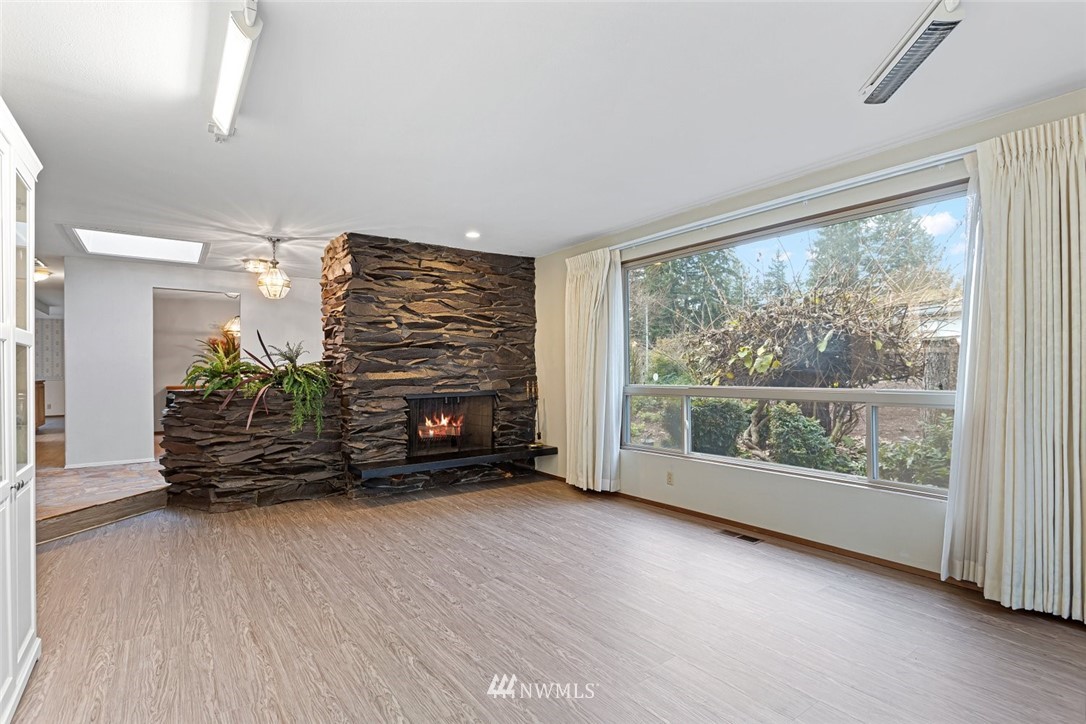 16418 Southeast 145th Street Renton, WA 98059 - Photo 9 of 25 wooden floor in an empty room with a window