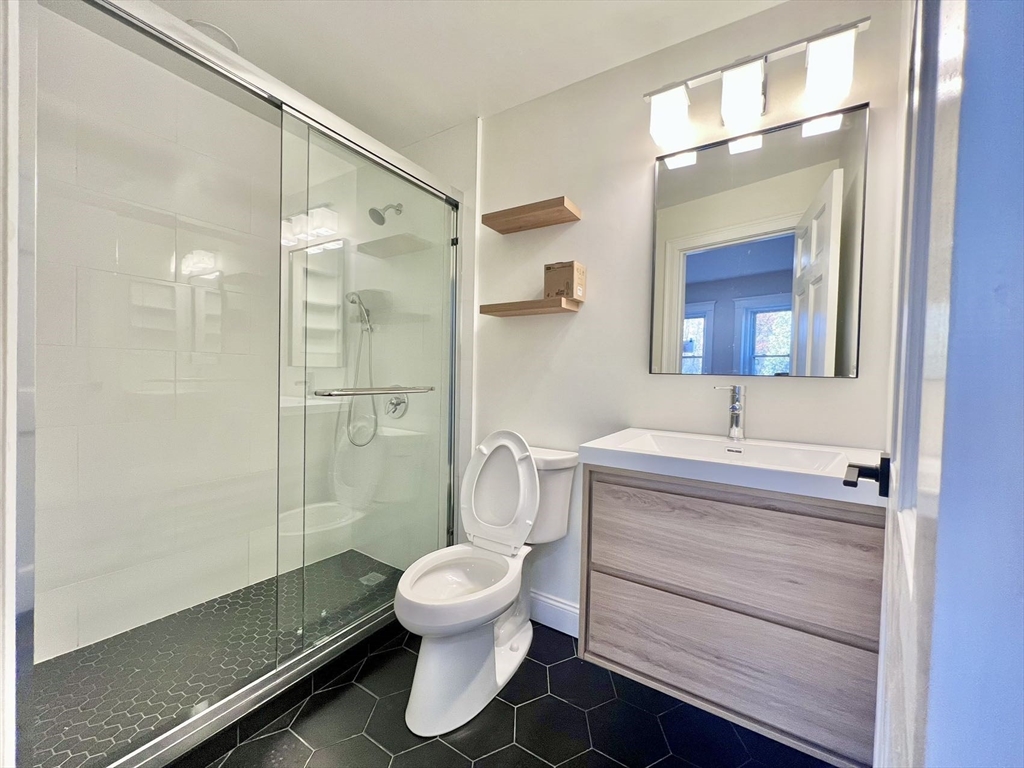 6 Parkway Brookline Ma, Unit 2 Brookline, MA 02445 - Photo 5 of 10 a bathroom with a toilet sink and shower