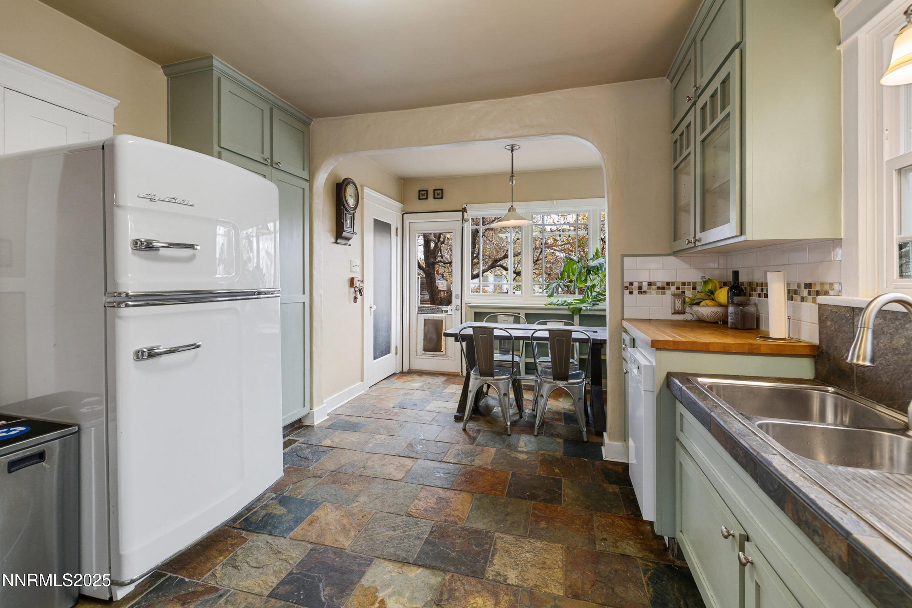 948 Washington Street Reno, NV 89503 - Photo 11 of 29 a kitchen with granite countertop a sink appliances and cabinets
