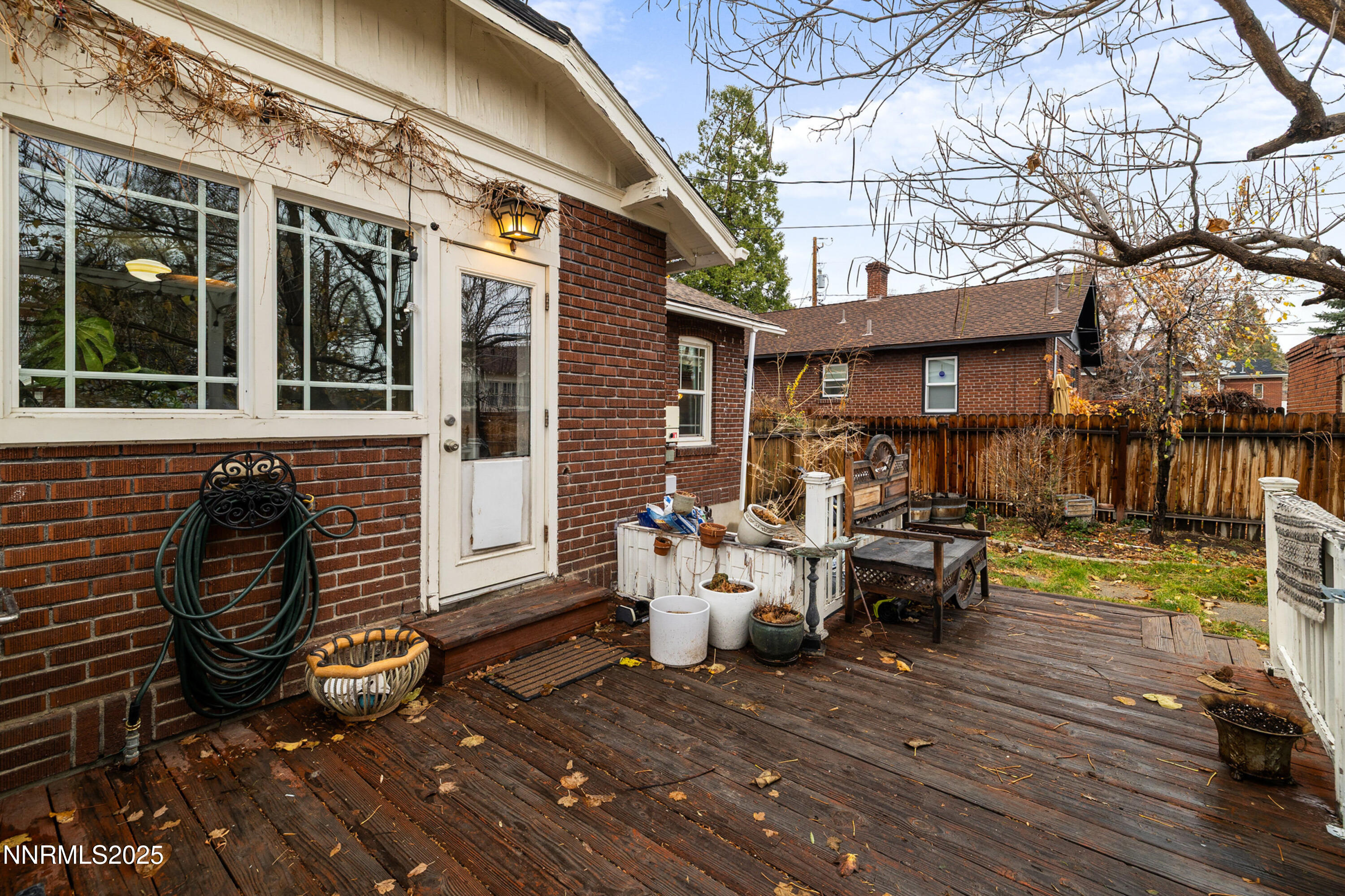 948 Washington Street Reno, NV 89503 - Photo 24 of 29 a view of a patio with table and chairs and wooden fence