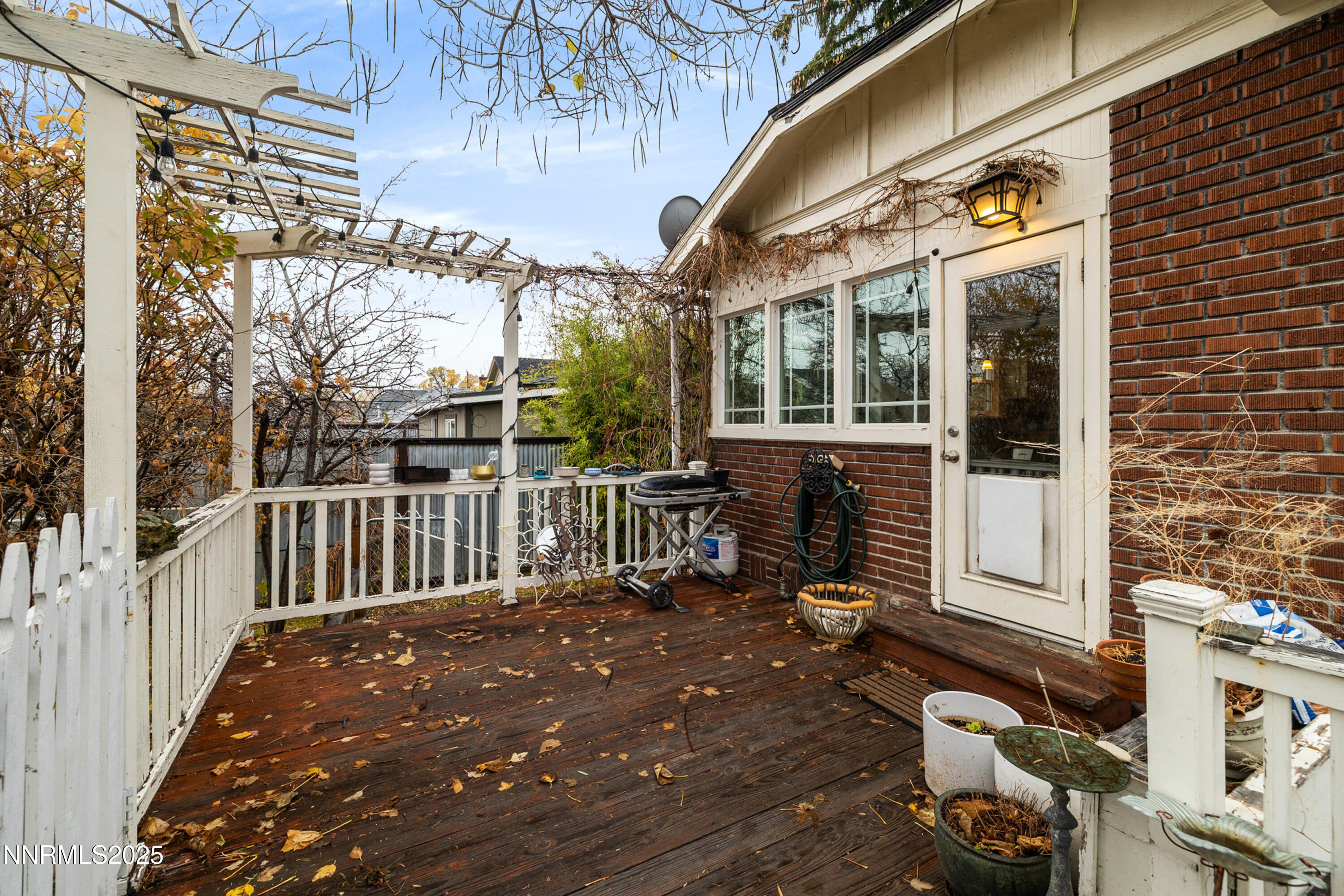 948 Washington Street Reno, NV 89503 - Photo 26 of 29 a balcony view with a large window and outdoor seating