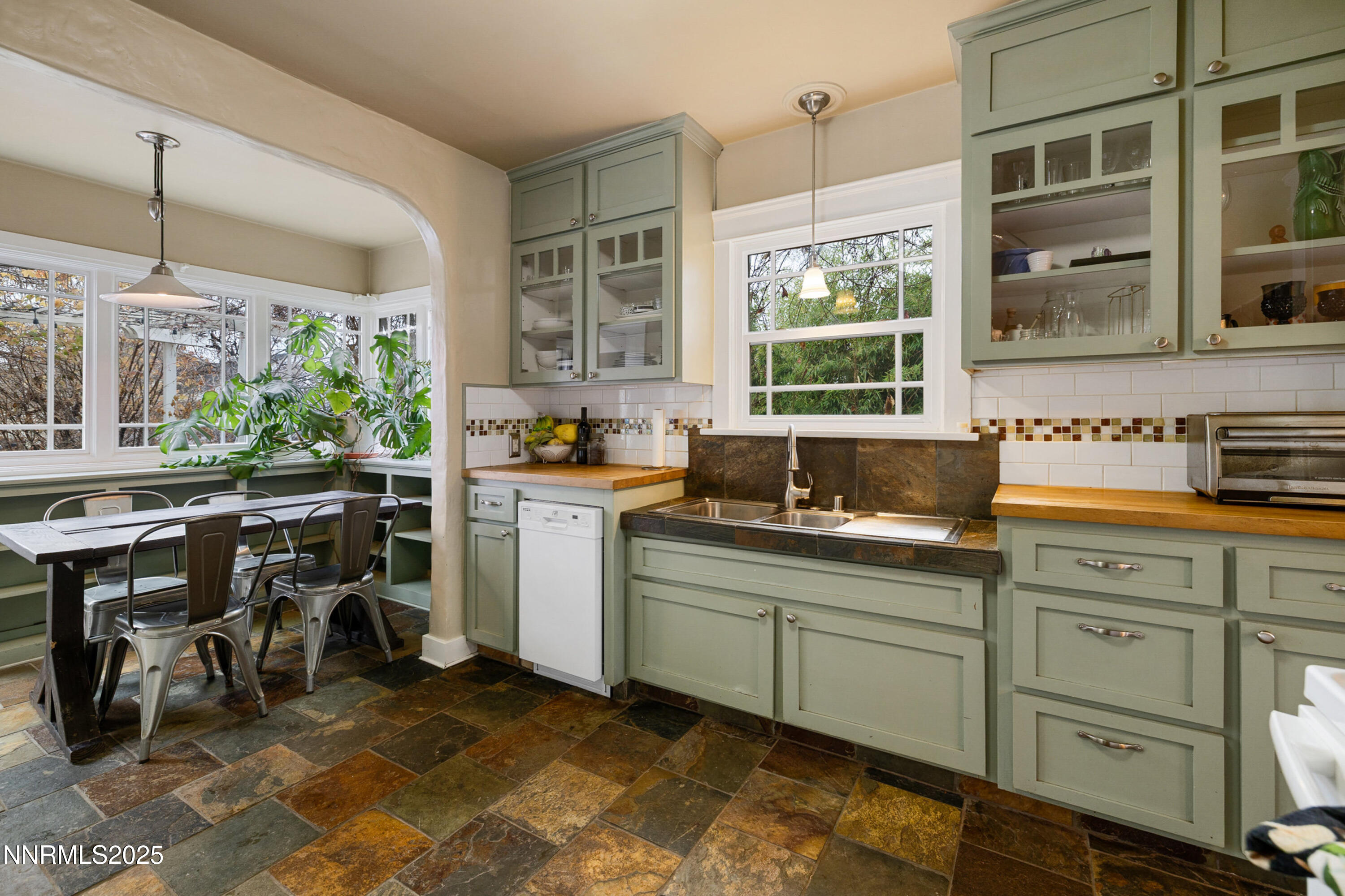 948 Washington Street Reno, NV 89503 - Photo 3 of 29 a kitchen that has a sink and a table in it