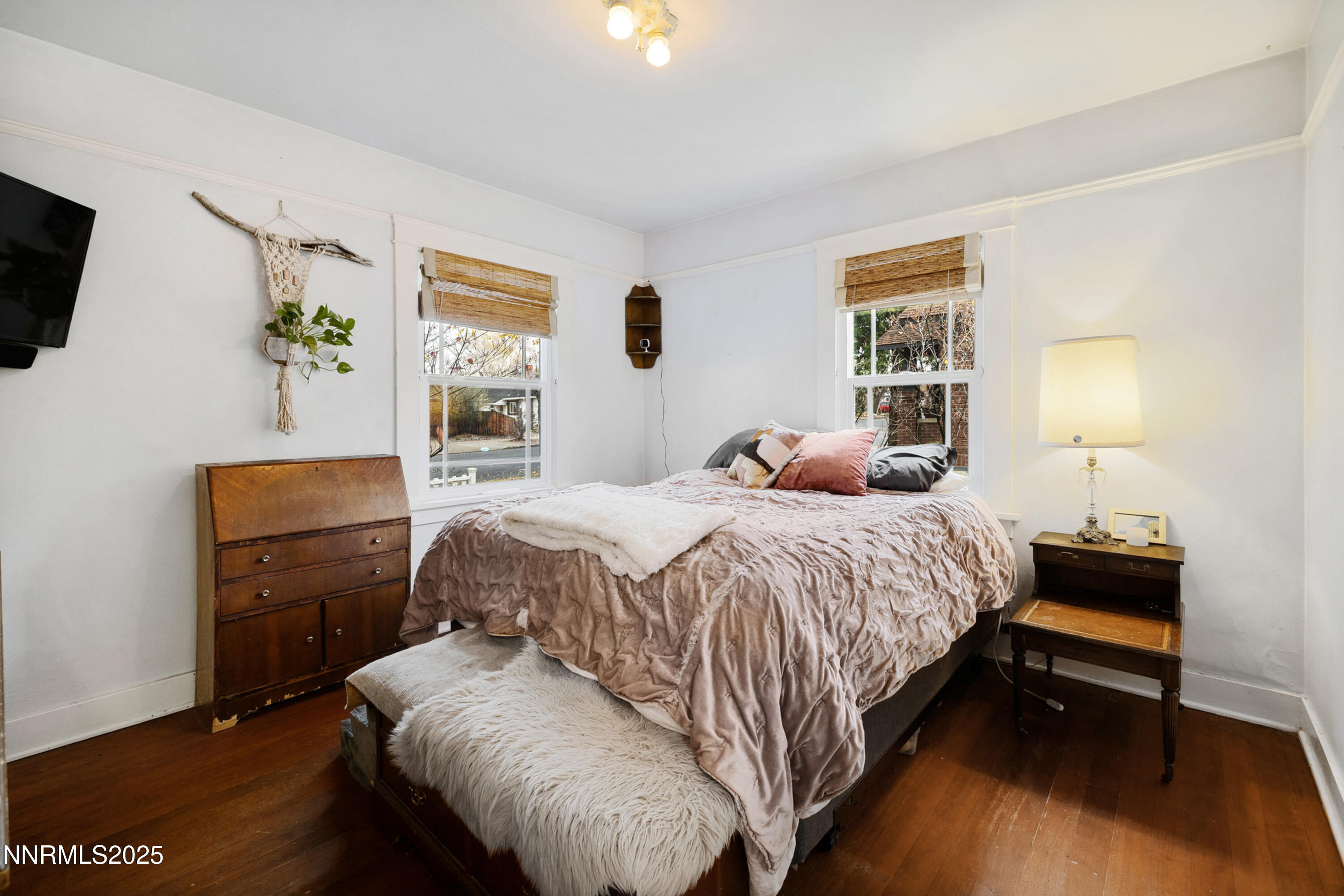 948 Washington Street Reno, NV 89503 - Photo 4 of 29 a bedroom with a bed and wooden floor