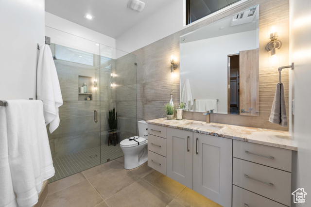 3558 South Cypress Road Hurricane, UT 84737 - Photo 25 of 57 Bathroom with tile flooring, vanity, an enclosed shower, and toilet