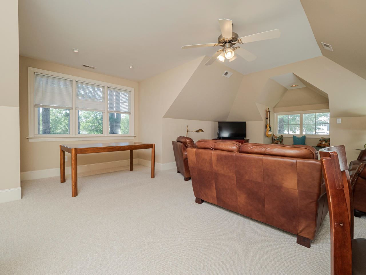 1217 Colonial Club Road Wake Forest, NC 27587 - Photo 22 of 30 More windows for sunshine and natural light. The door to the incredible walk-in storage is nearby too! Sunlit Bonus