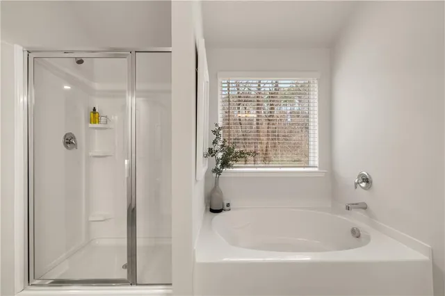a white bath tub sitting next to a window