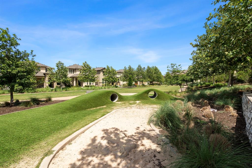 6814 East Riverside Drive, Unit 25 Austin, TX 78741 - Photo 24 of 26 View of home's community featuring a yard