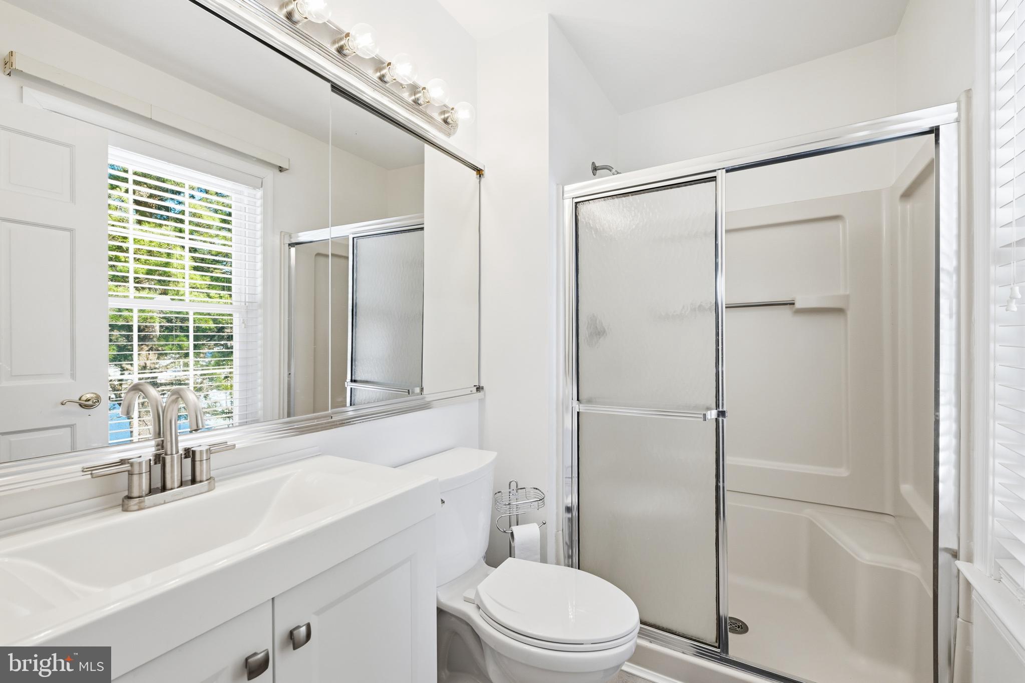 55 Violet Lane Newtown, PA 18940 - Photo 17 of 24 a bathroom with a sink a toilet and shower