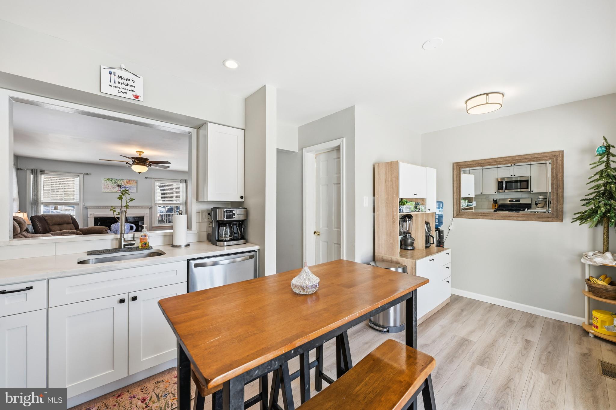 55 Violet Lane Newtown, PA 18940 - Photo 3 of 24 a kitchen with stainless steel appliances cabinets dining table and chairs