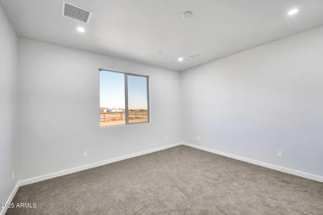 an empty room with closet area