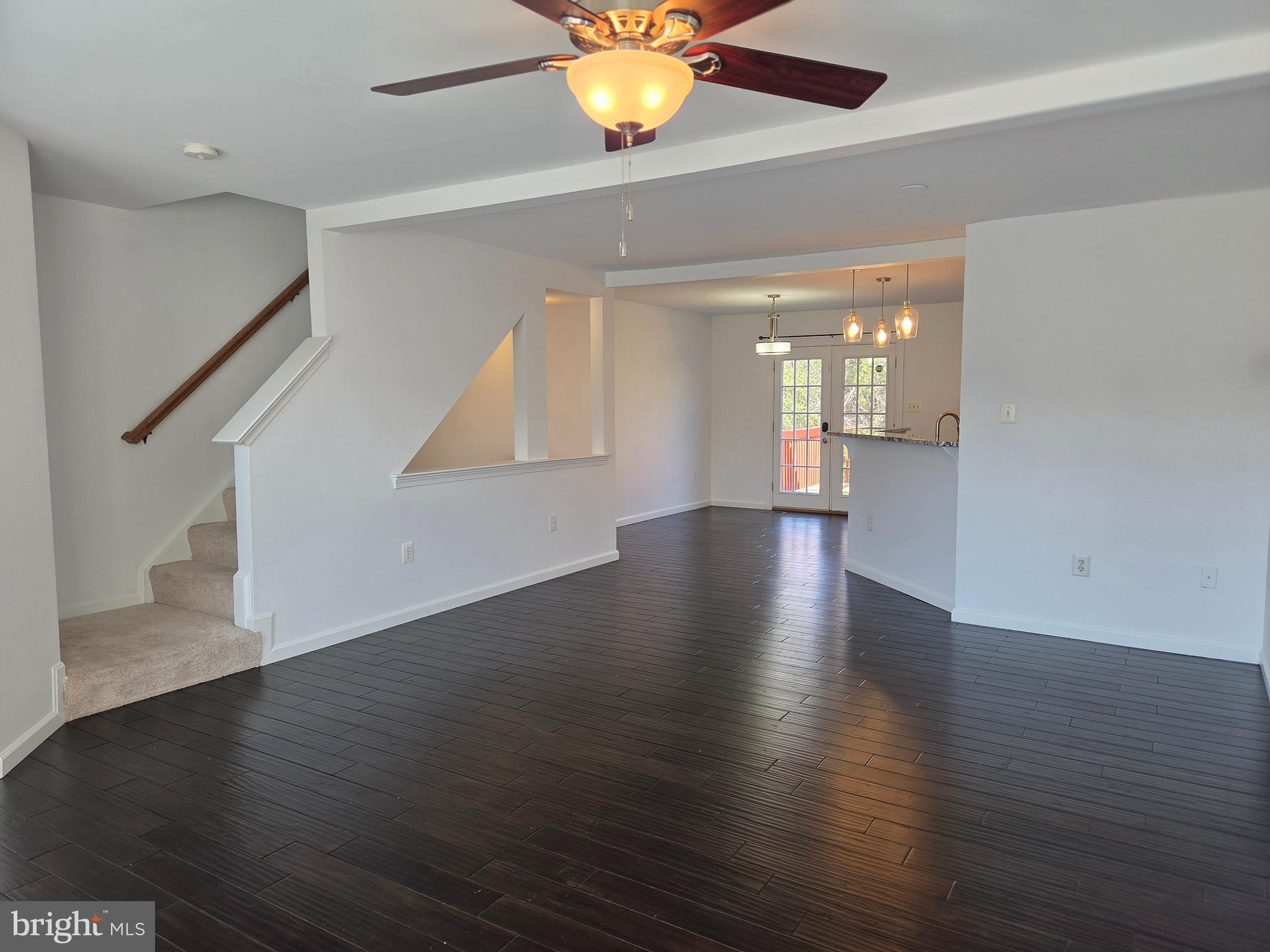 17381 Sligo Loop Dumfries, VA 22026 - Photo 11 of 35 a view of an empty room with wooden floor and a window