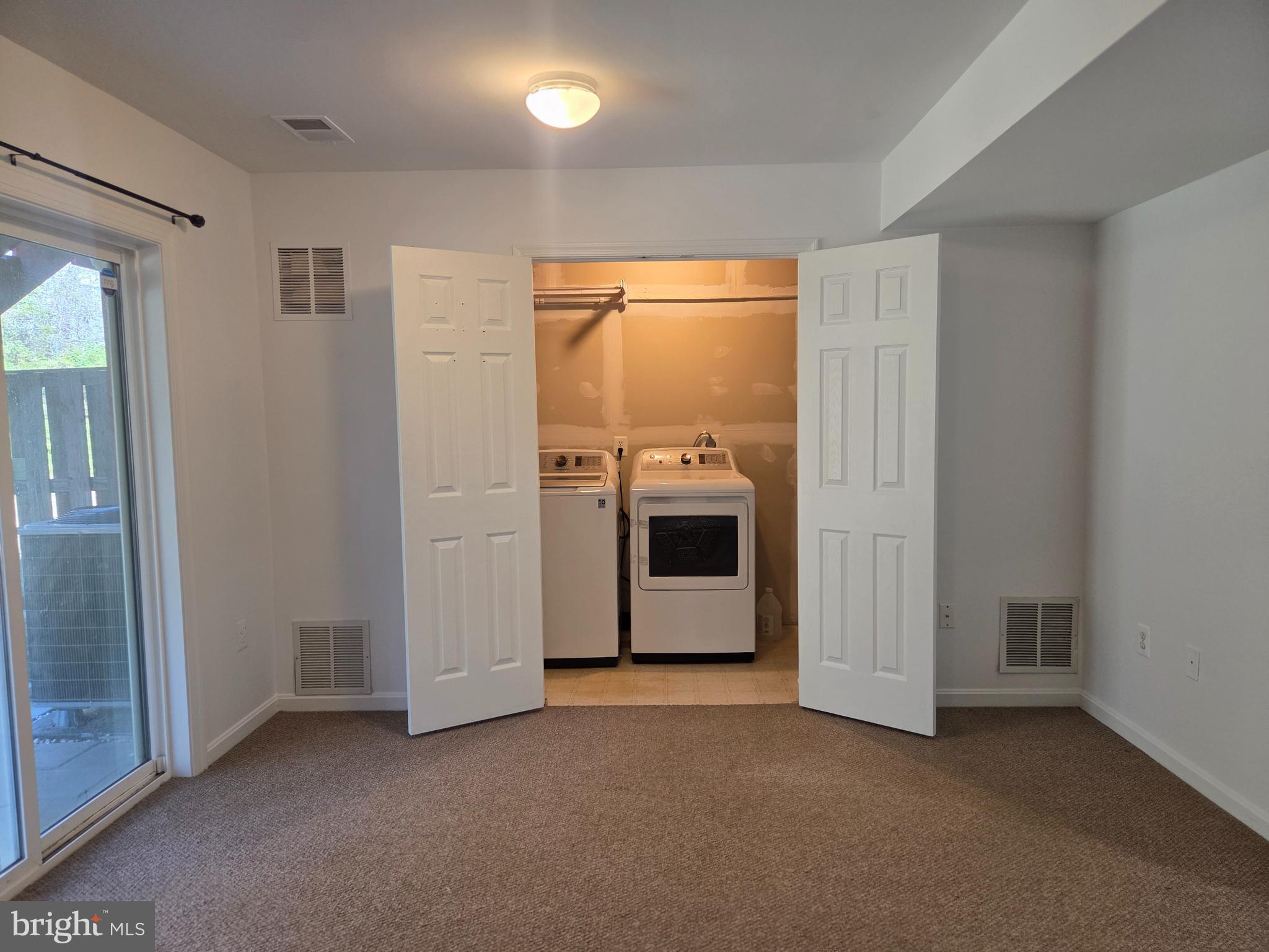 17381 Sligo Loop Dumfries, VA 22026 - Photo 26 of 35 a view of a kitchen with washer and dryer