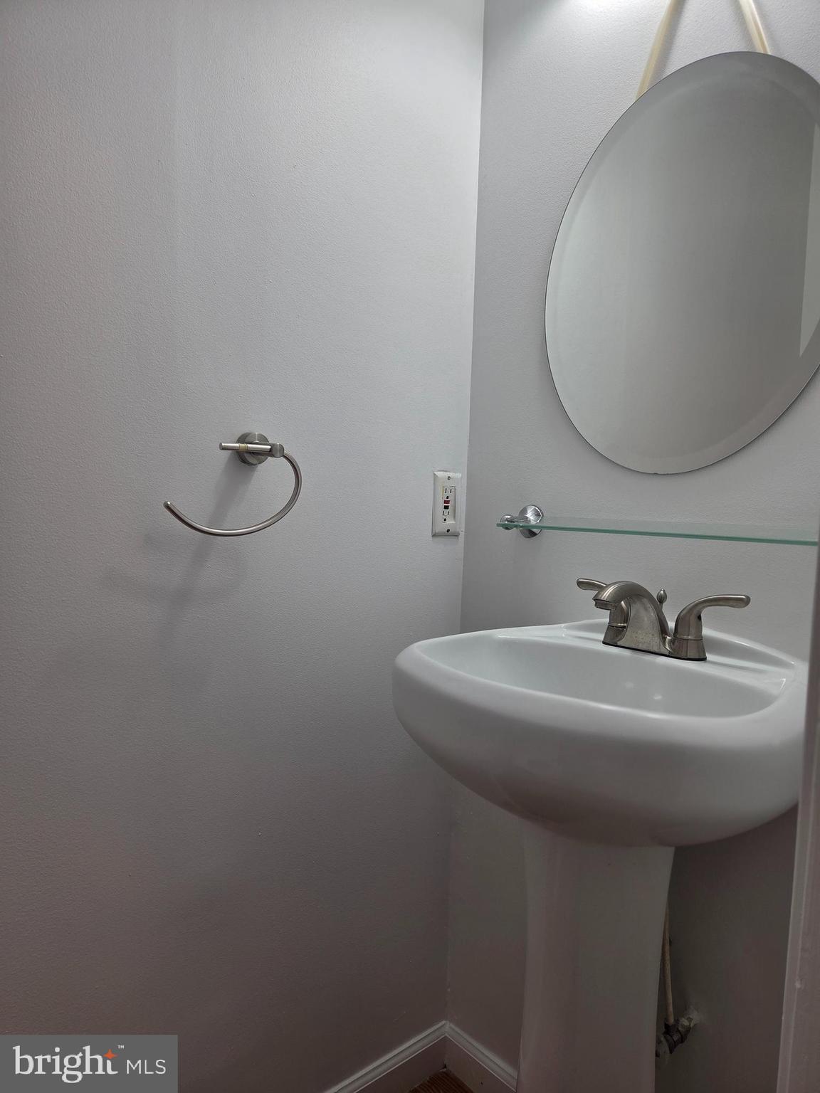 17381 Sligo Loop Dumfries, VA 22026 - Photo 29 of 35 a bathroom with a sink a toilet and a mirror