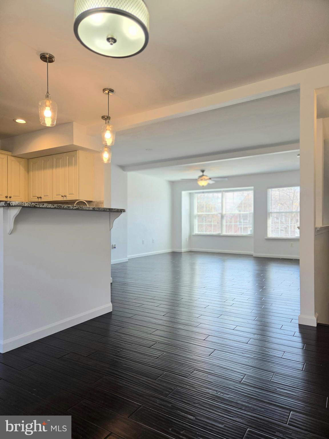 17381 Sligo Loop Dumfries, VA 22026 - Photo 8 of 35 wooden floor in an empty room with a window