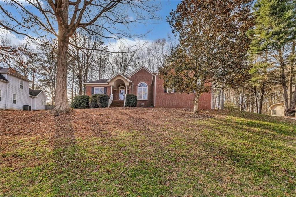 a front view of a house with a yard
