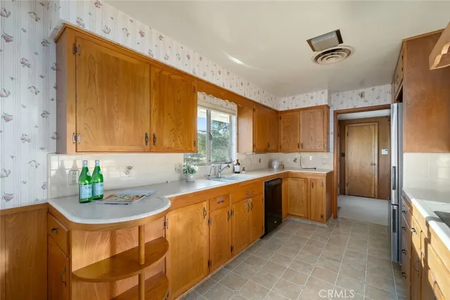 a view of a dining room with furniture and a chandelier