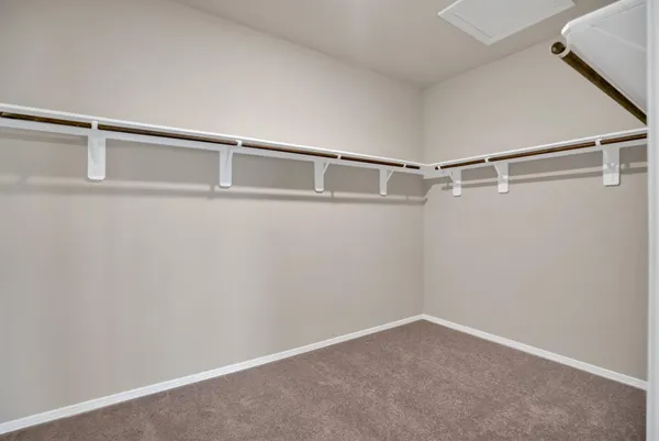 a view of an empty walk in closet