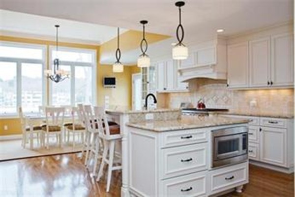 54 Winston Road Newton, MA 02459 - Photo 4 of 13 a kitchen with stainless steel appliances granite countertop a sink a stove and a wooden floors