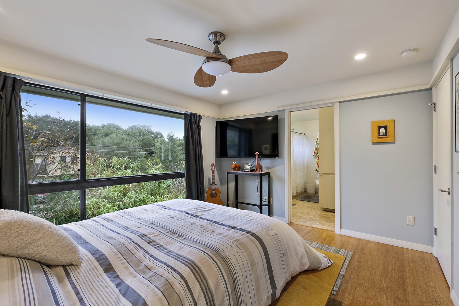 805 Cumberland Road, Unit B Austin, TX 78704 - Photo 23 of 37 a bedroom with a bed and a large window