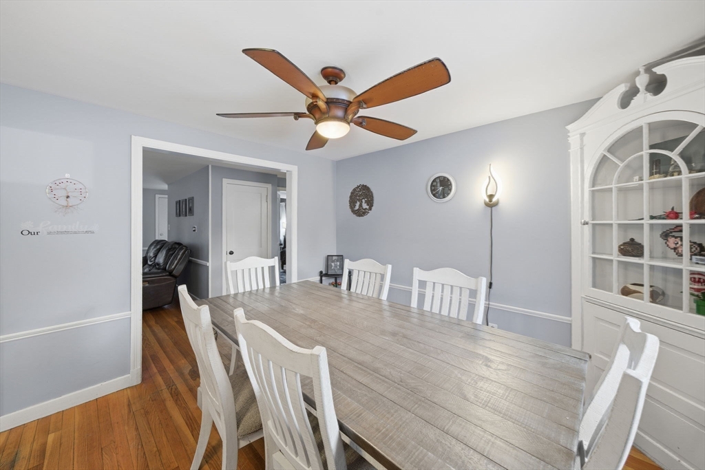 8 Flint Street Chelmsford, MA 01824 - Photo 5 of 20 a dining room with wooden floor and a chandelier