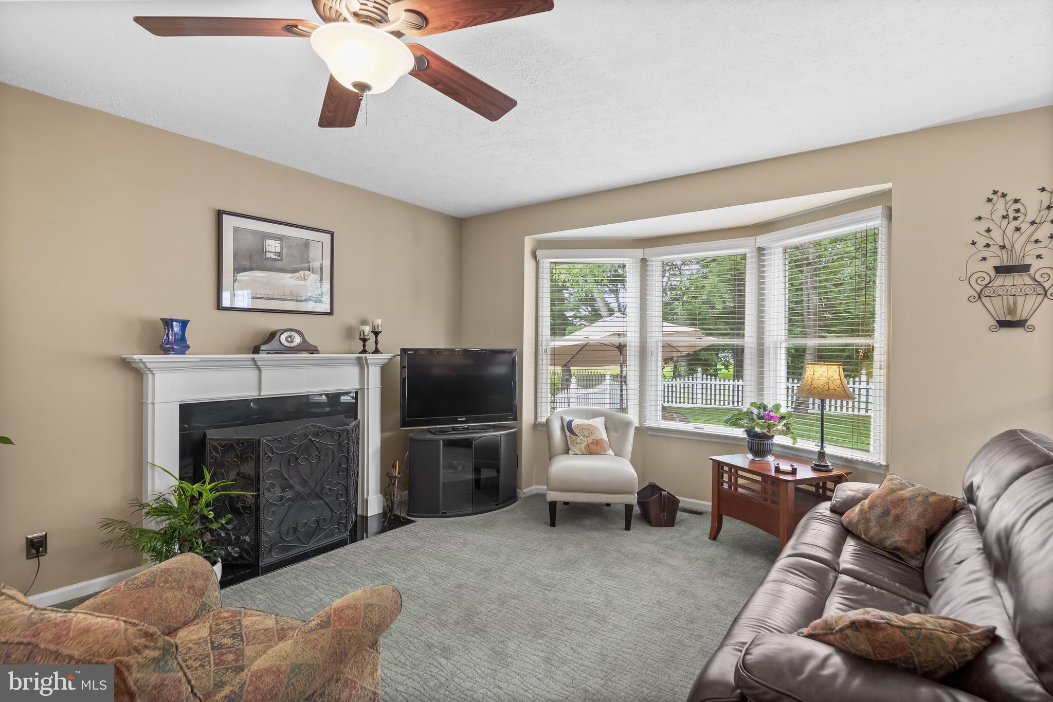 536 Justice Drive Marlton, NJ 08053 - Photo 18 of 44 a living room with furniture a fireplace and a flat screen tv