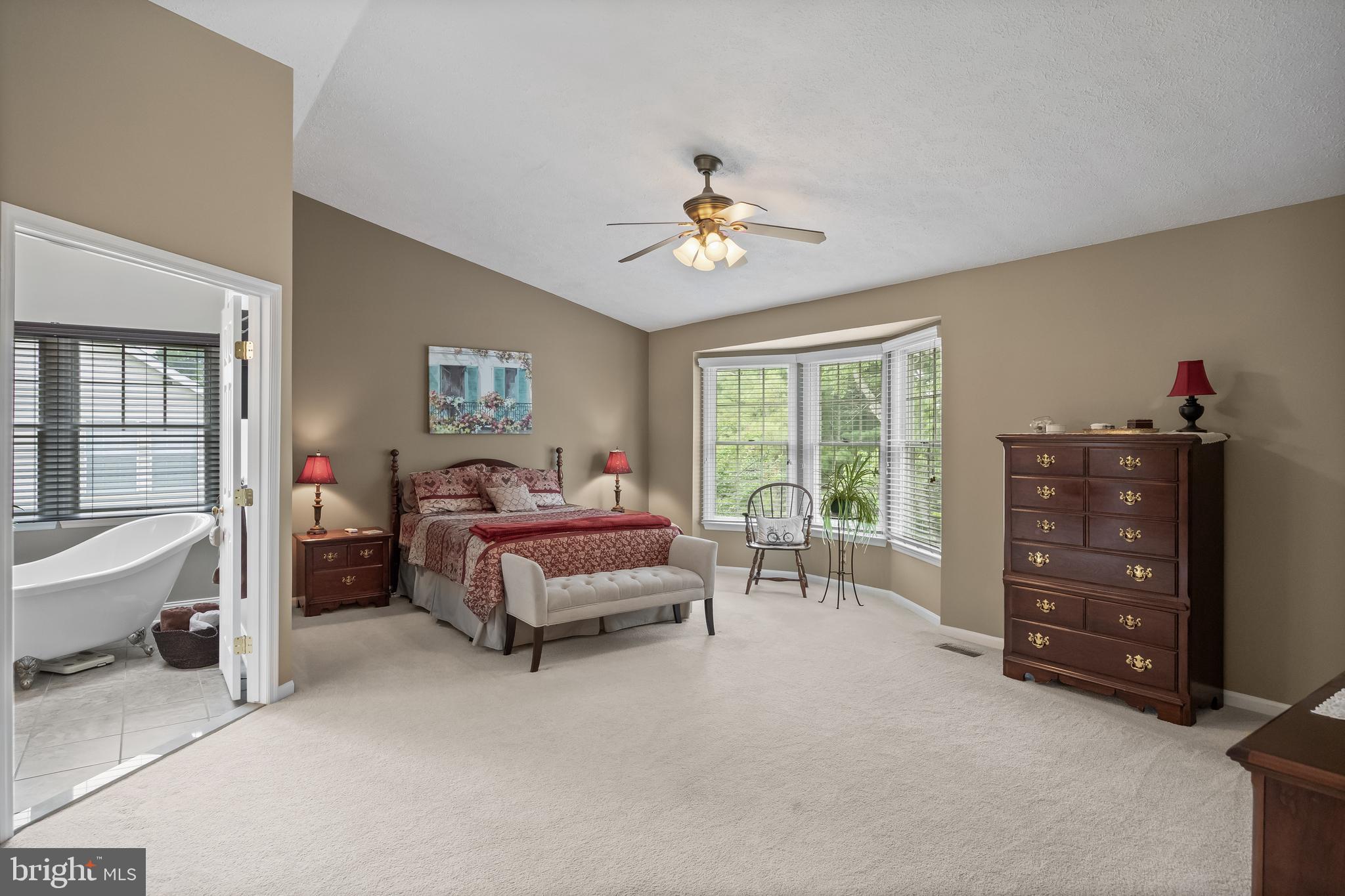 536 Justice Drive Marlton, NJ 08053 - Photo 24 of 44 a spacious bedroom with a bed and a chandelier