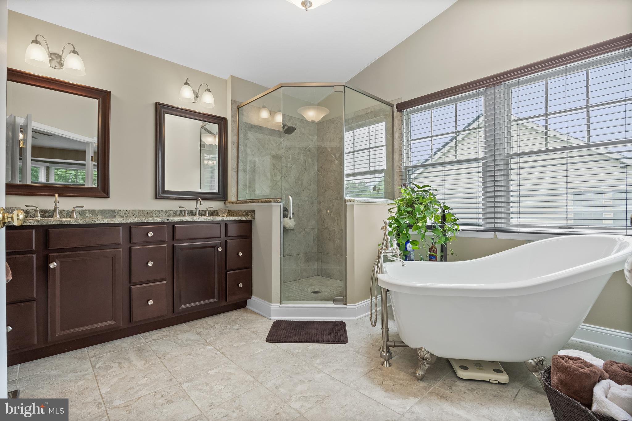 536 Justice Drive Marlton, NJ 08053 - Photo 27 of 44 a spacious bathroom with a tub sink and mirror