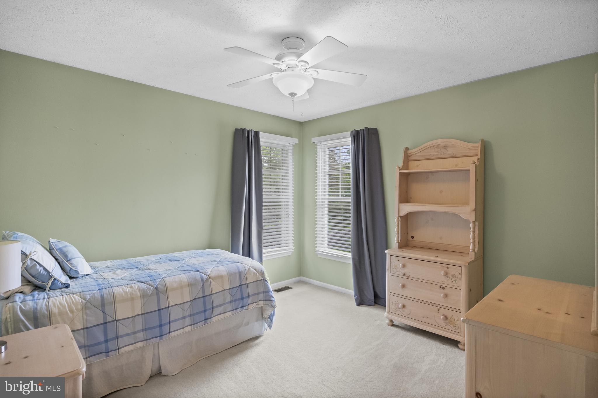 536 Justice Drive Marlton, NJ 08053 - Photo 33 of 44 a bedroom with a bed and a chandelier