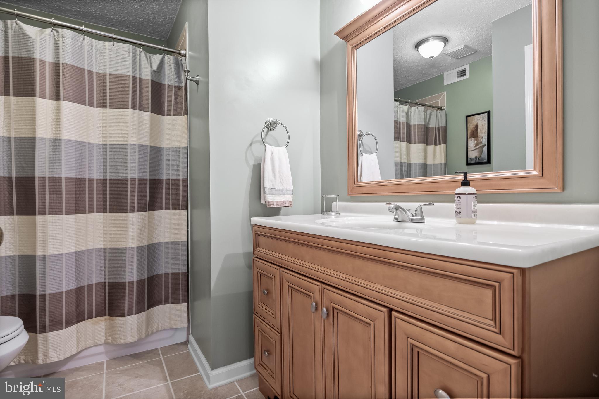 536 Justice Drive Marlton, NJ 08053 - Photo 35 of 44 a bathroom with a sink and a mirror