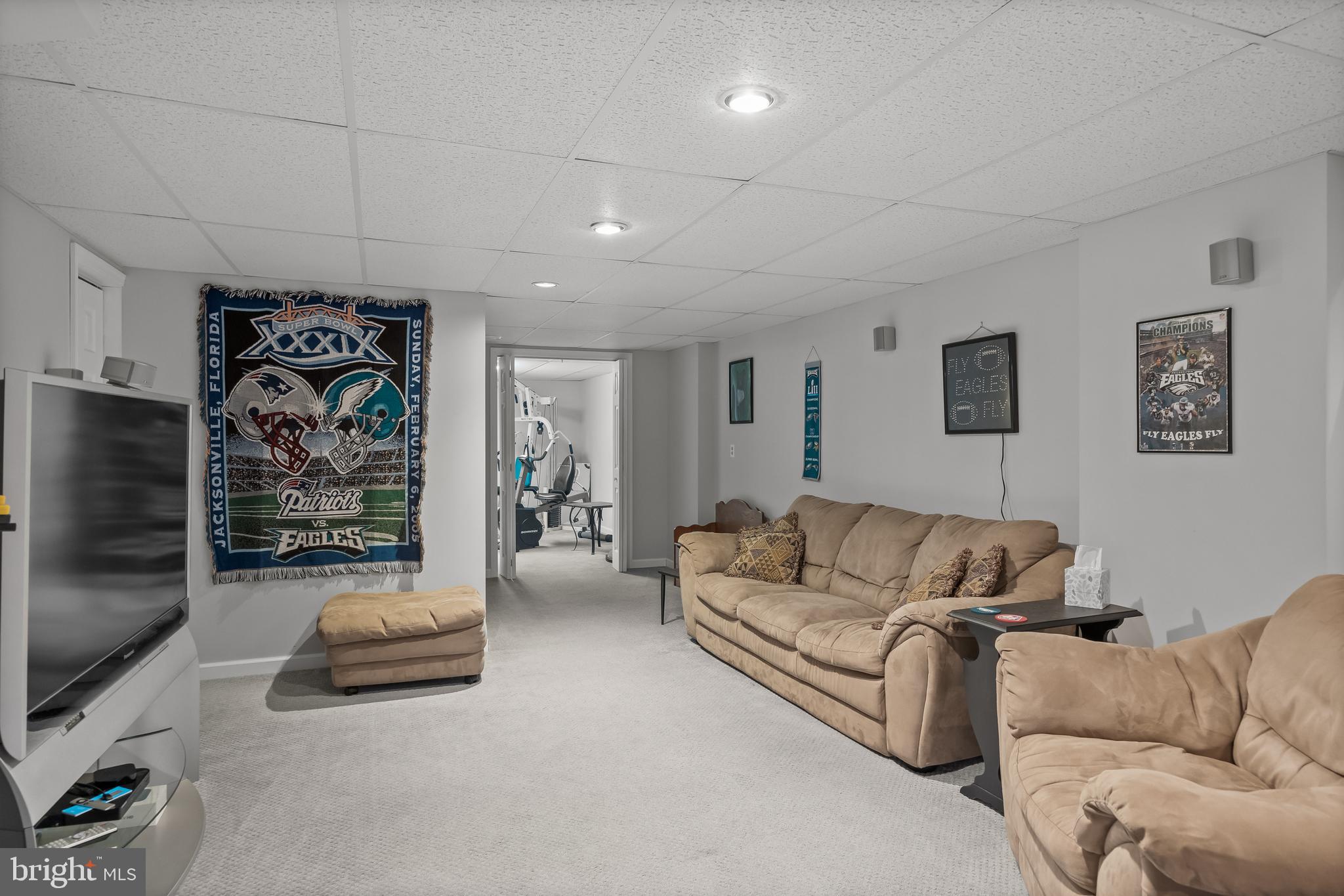 536 Justice Drive Marlton, NJ 08053 - Photo 38 of 44 a living room with furniture and a flat screen tv