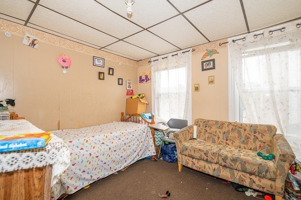 7 Cutler Street Worcester, MA 01604 - Photo 11 of 21 a bedroom with a bed and a window