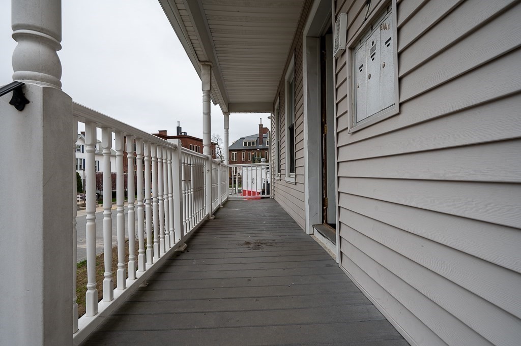 7 Cutler Street Worcester, MA 01604 - Photo 3 of 21 a view of a balcony with wooden floor