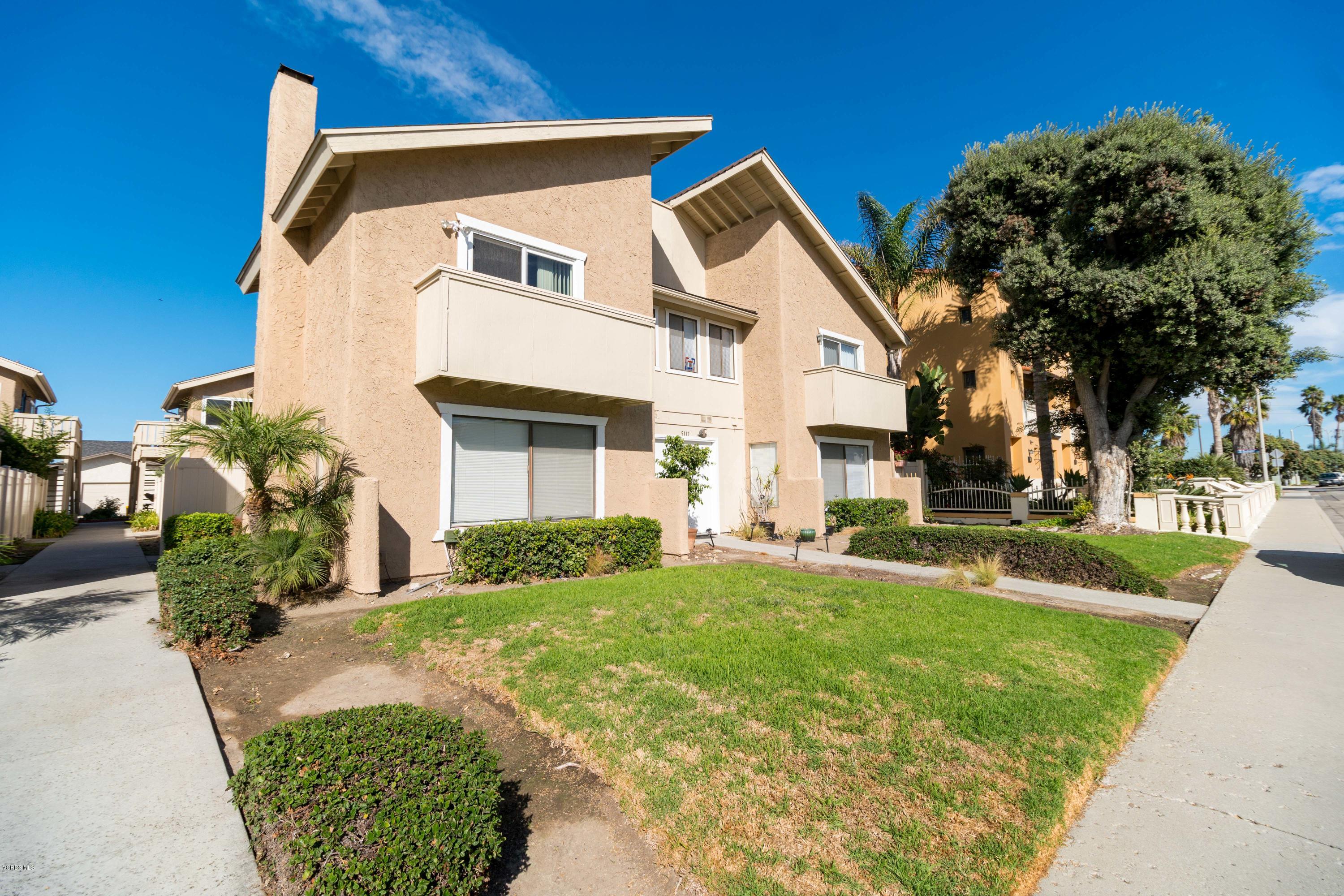 5117 West Wooley Road, Unit 3 Oxnard, CA 93035 - Photo 14 of 23 a front view of a house with a yard