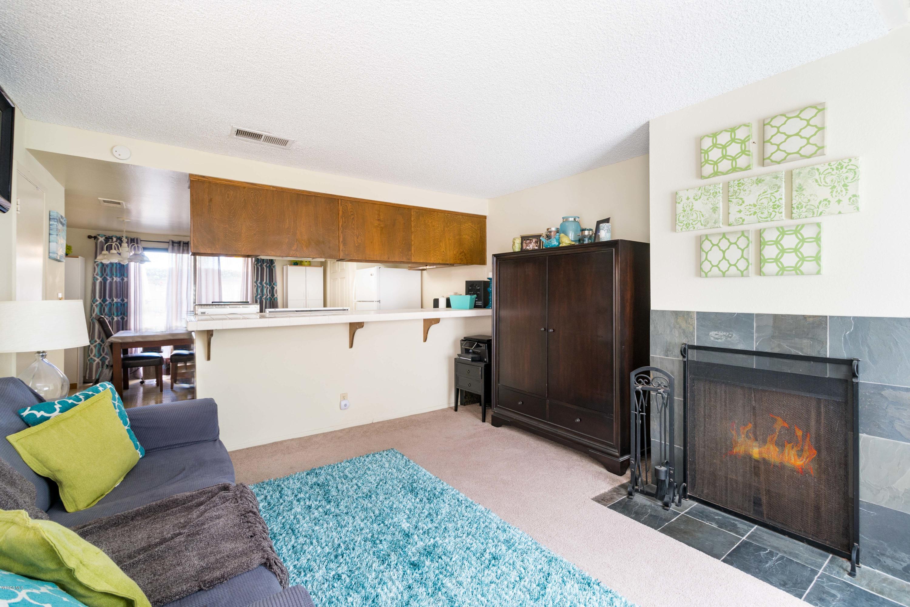 5117 West Wooley Road, Unit 3 Oxnard, CA 93035 - Photo 8 of 23 a kitchen with a refrigerator coffee maker on the counter