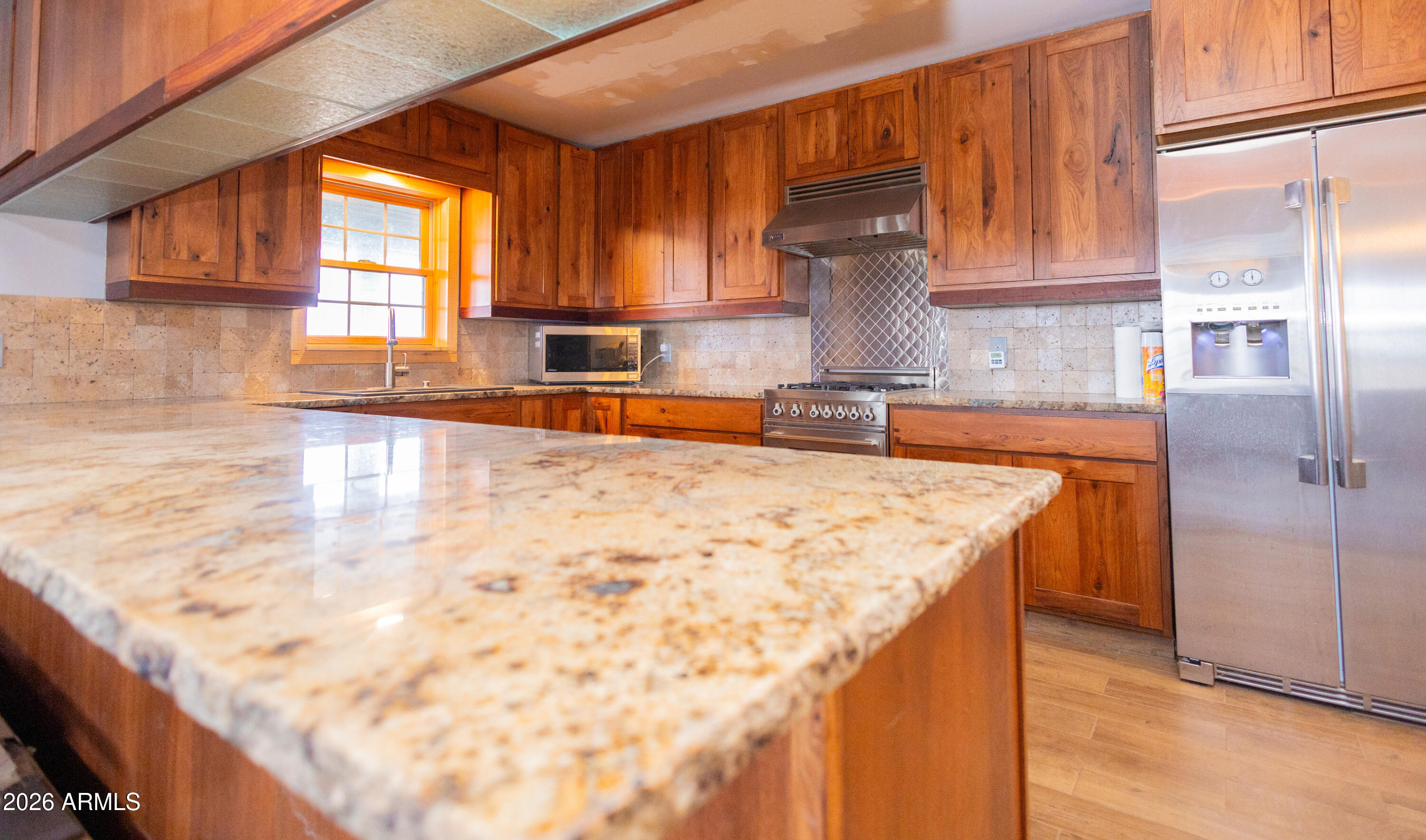 3429 West Markel Road Douglas, AZ 85607 - Photo 23 of 47 a kitchen with stainless steel appliances granite countertop a sink window and cabinets