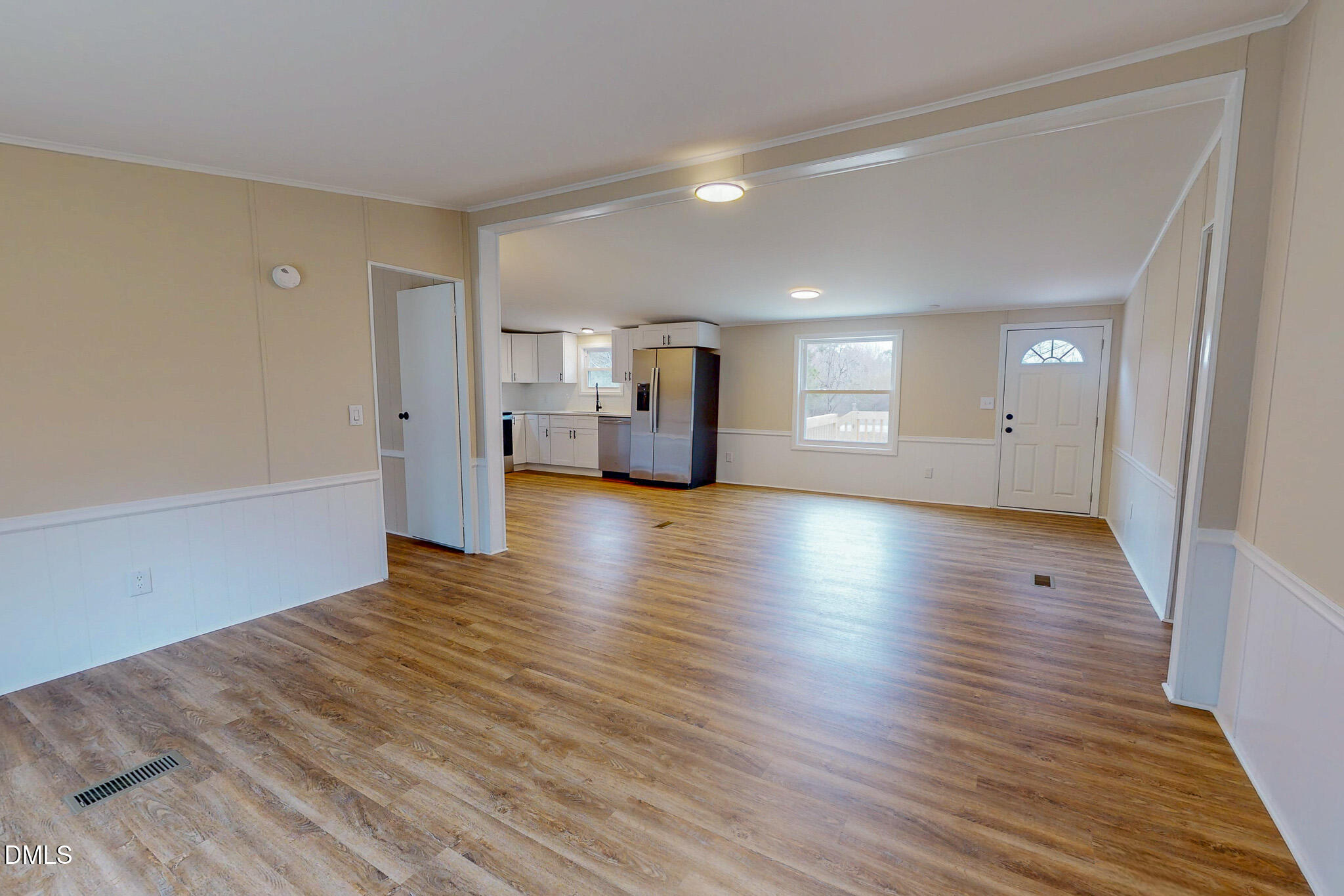 67 Halifax Road Roxboro, NC 27574 - Photo 24 of 48 a view of a big room with wooden floor and windows