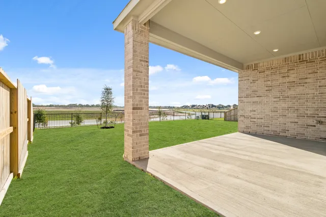 a view of a terrace with a big yard