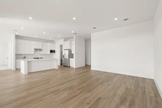 a view of kitchen with wooden floor