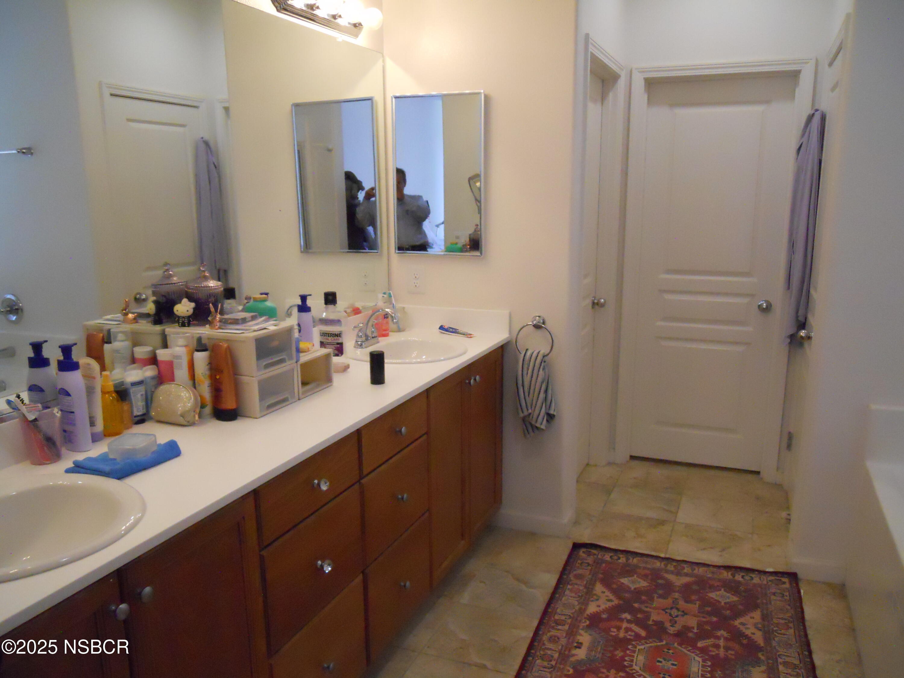 1000 Conception Drive Lompoc, CA 93436 - Photo 14 of 21 a bathroom with a sink and a mirror