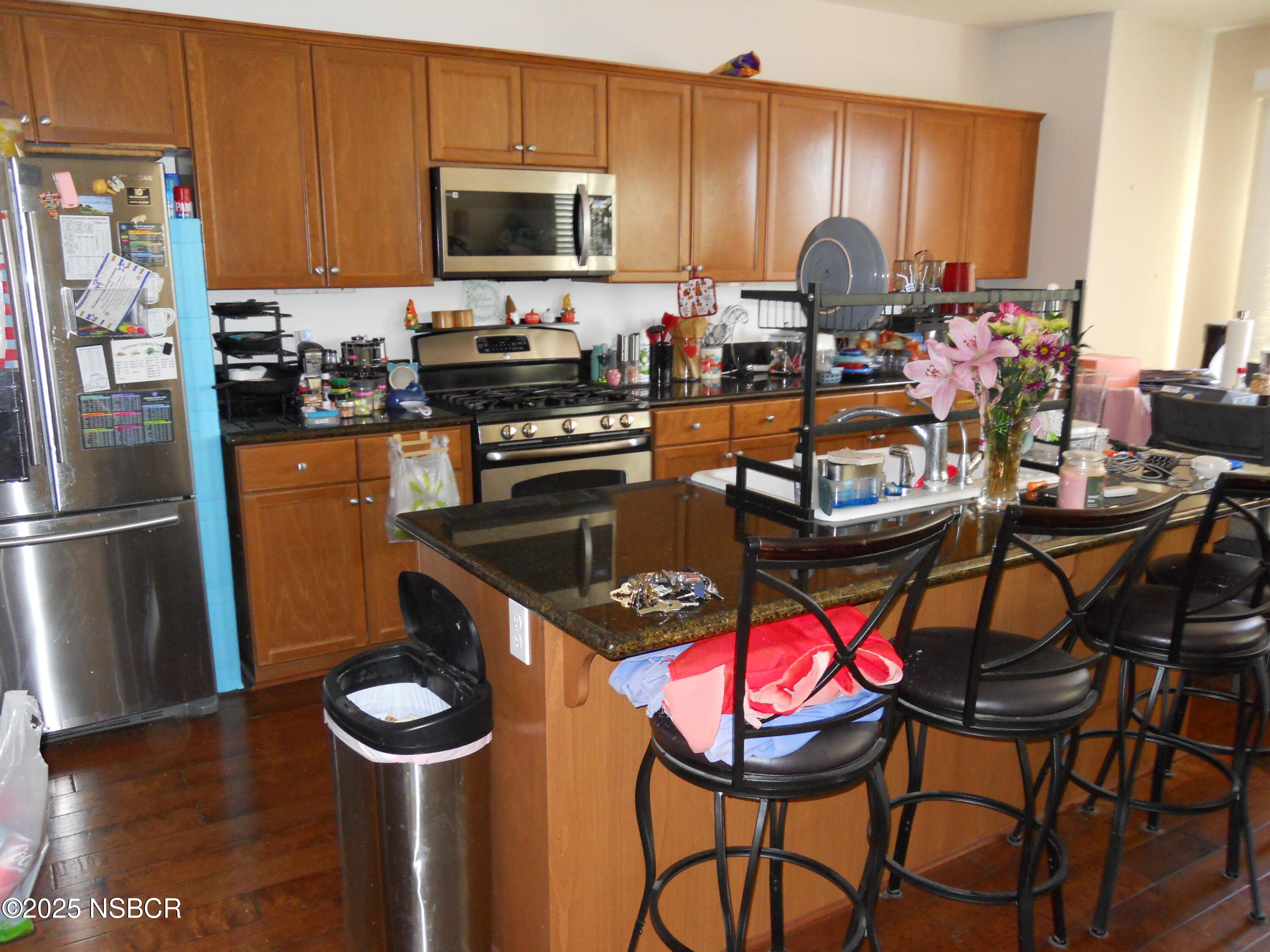 1000 Conception Drive Lompoc, CA 93436 - Photo 5 of 21 a kitchen with stainless steel appliances granite countertop a stove top oven a refrigerator a sink and a microwave