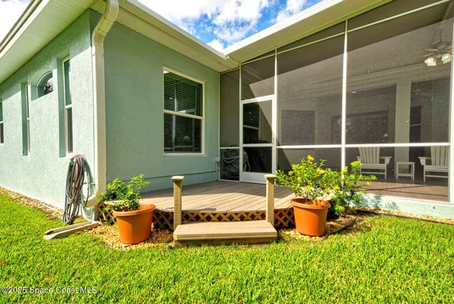 a view of a house with garden and plants