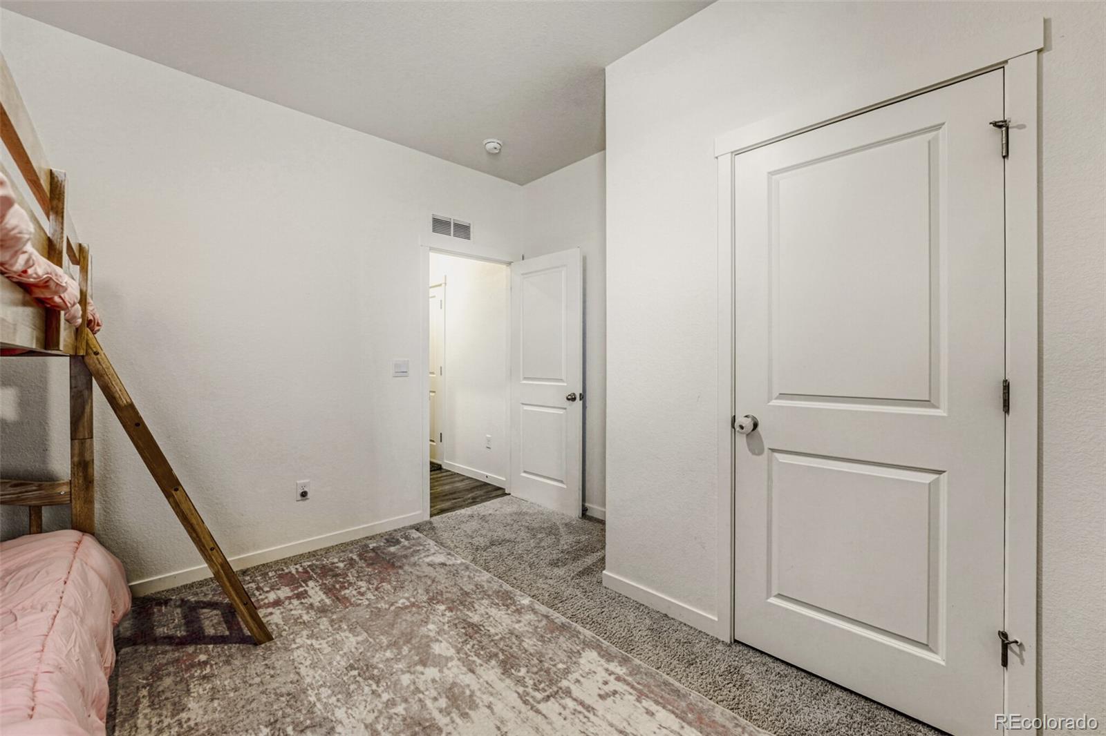 166 Racer Street Bennett, CO 80102 - Photo 29 of 44 a view of a storage & utility room